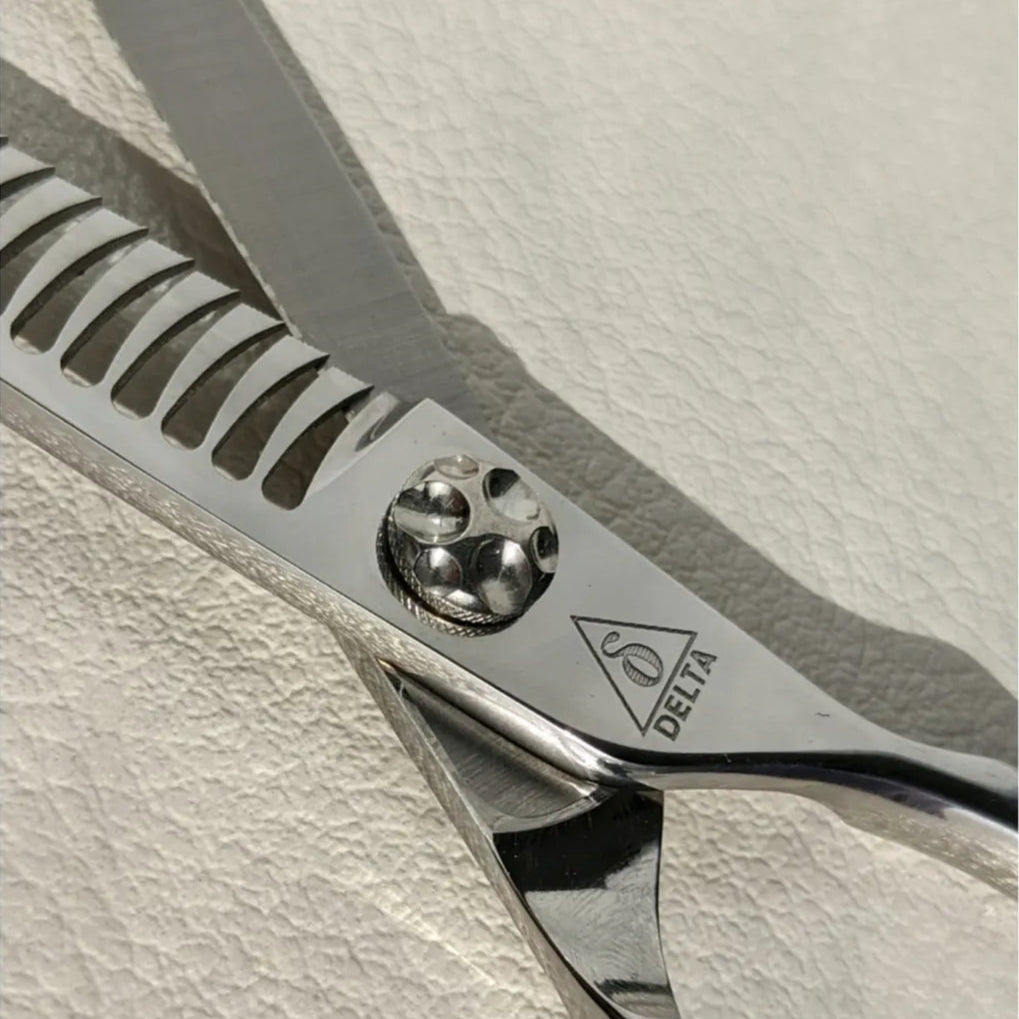 Delta Warrior Chunker Grooming Scissors ultra close up of branding 